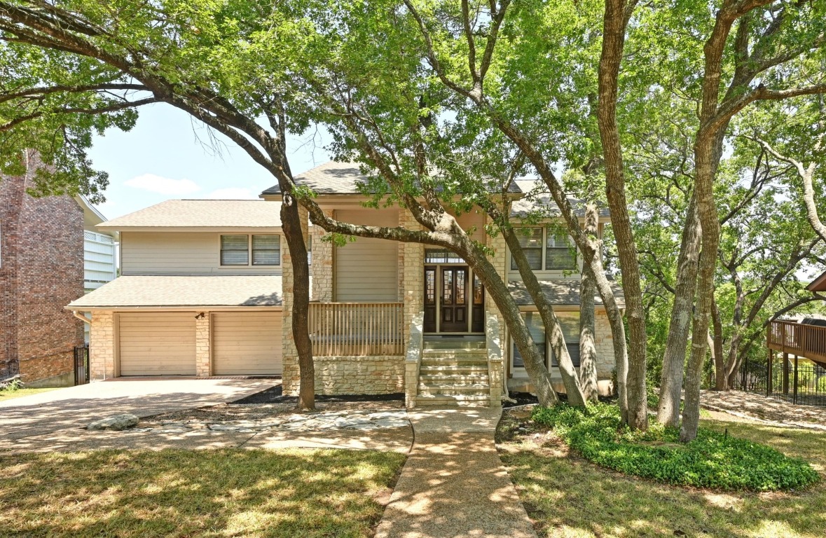 3510 Native Dancer Cove Austin, TX 78746 - Photo 2 of 35 a view of a house with a yard
