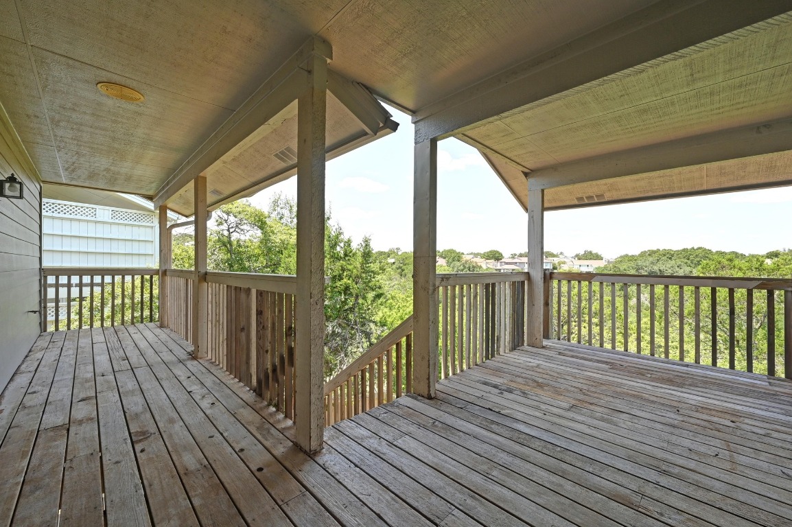 3510 Native Dancer Cove Austin, TX 78746 - Photo 30 of 35 a view of a wooden deck with a yard