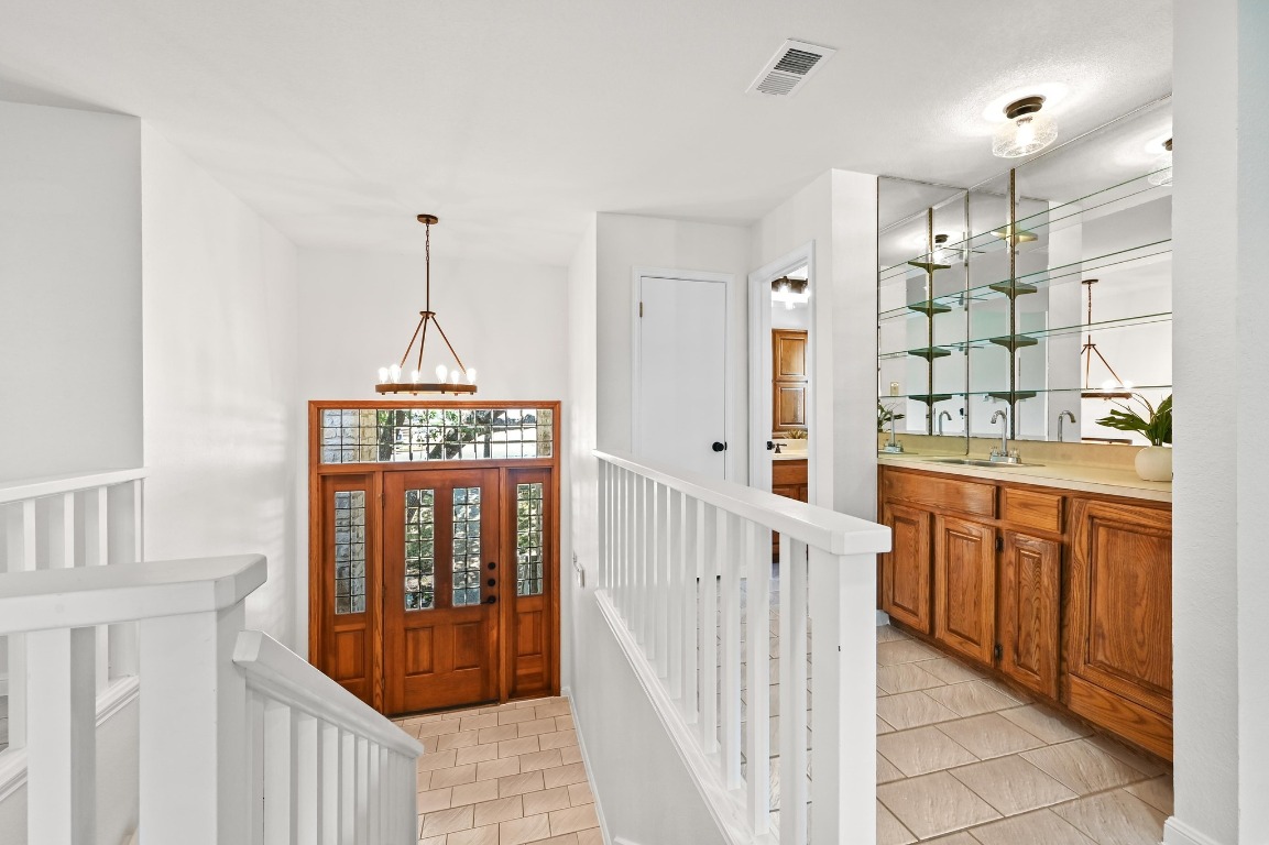 3510 Native Dancer Cove Austin, TX 78746 - Photo 5 of 35 a open kitchen with a sink stove and refrigerator