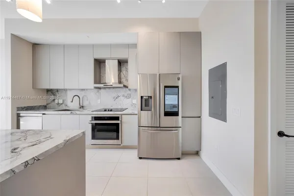 a living room with furniture and a washer dryer
