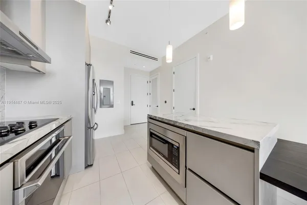 a bathroom with a double vanity sink and mirror
