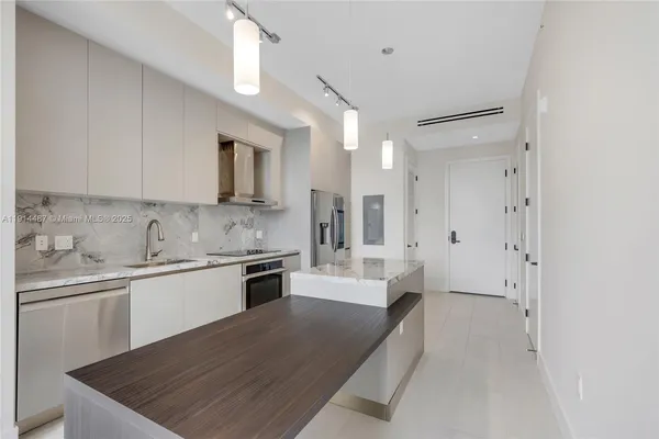 a bathroom with a double vanity sink and mirror