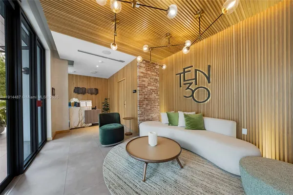 a living room with furniture and a rug