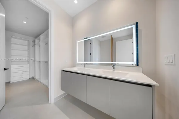 a balcony with furniture and a glass door