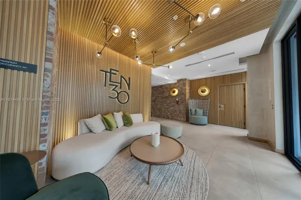 an empty room with sliding door and shower