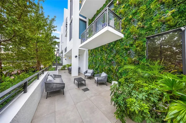 a view of a city and a big yard