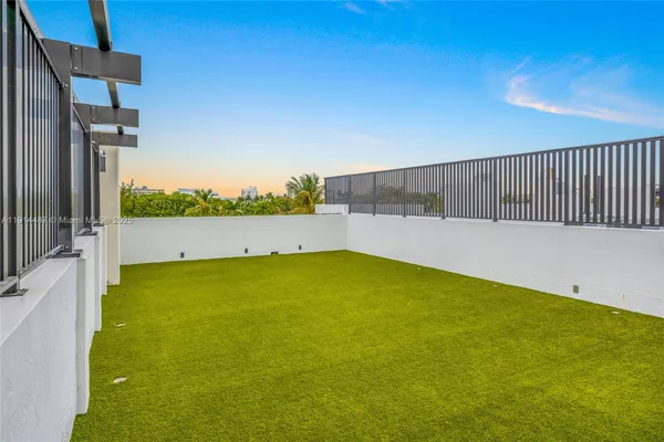 a view of swimming pool with outdoor seating and plants
