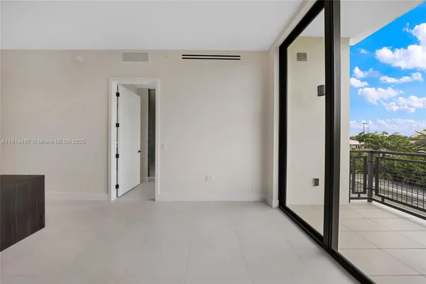 a view of a livingroom with furniture and a ceiling fan