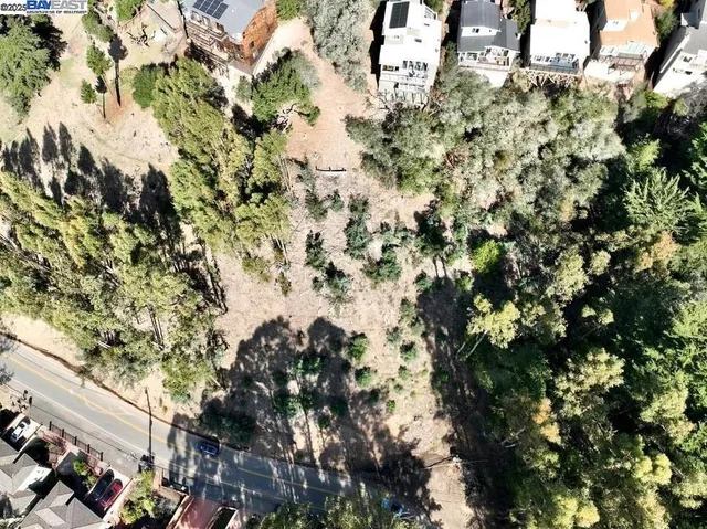 a backyard of a house with a yard and outdoor seating