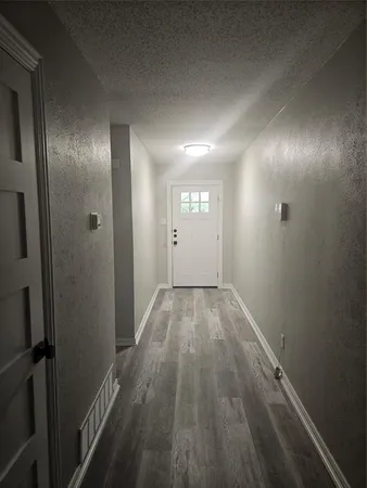 en empty room with wooden floor