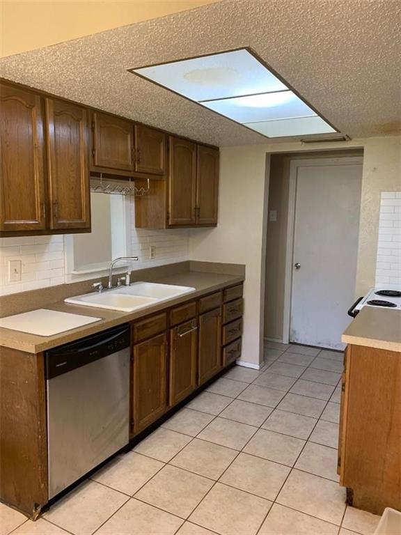 616 Carl C Senter Street Forney, TX 75126 - Photo 6 of 11 a kitchen with stainless steel appliances granite countertop a sink and a refrigerator