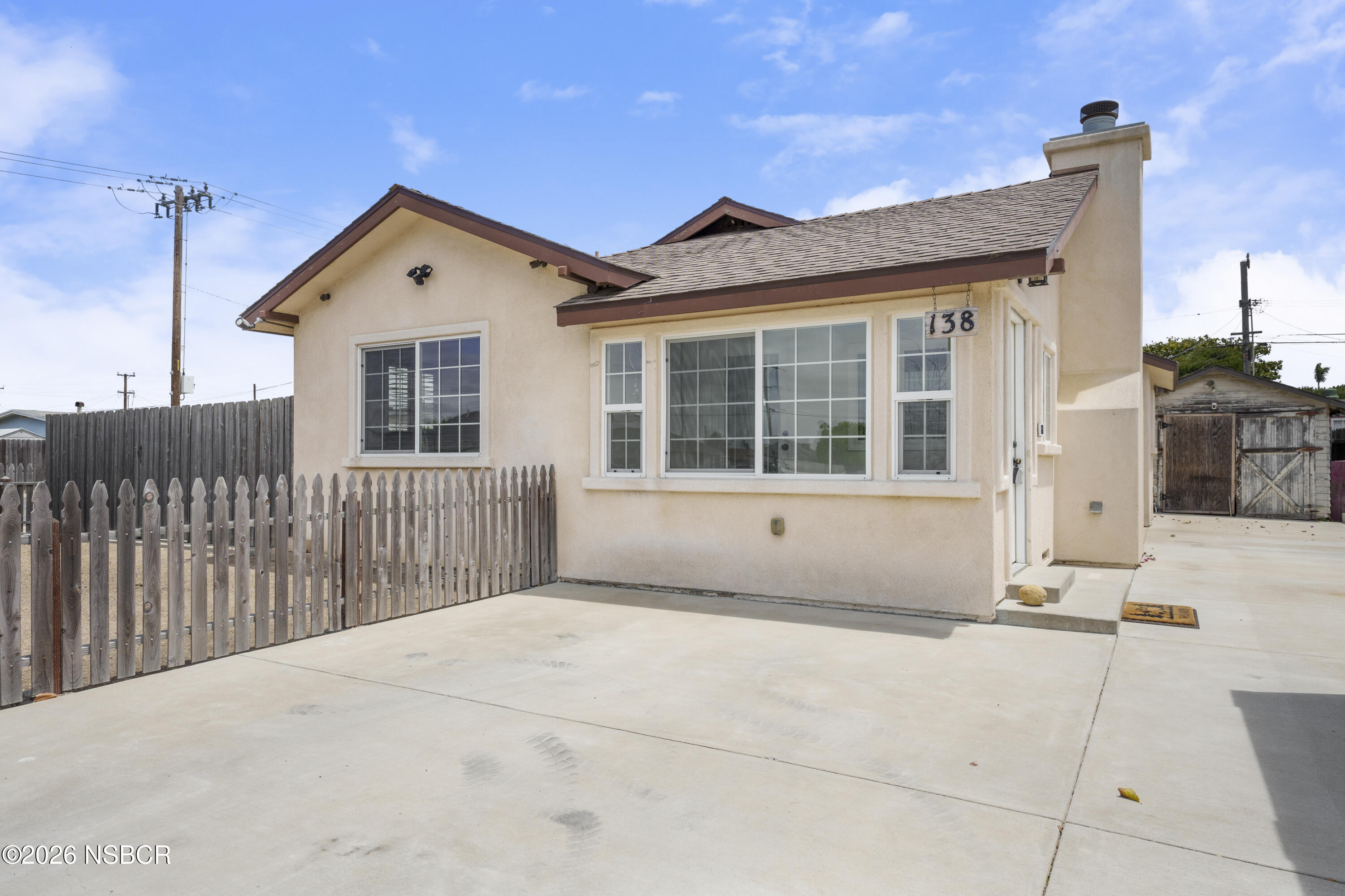 138 North E Street Lompoc, CA 93436 - Photo 4 of 35 a view of a house with a outdoor space