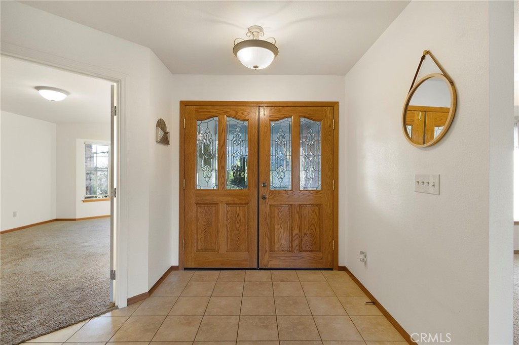 14856 Eagle Ridge Drive Forest Ranch, CA 95942 - Photo 16 of 27 an entryway with wooden floor and mirror