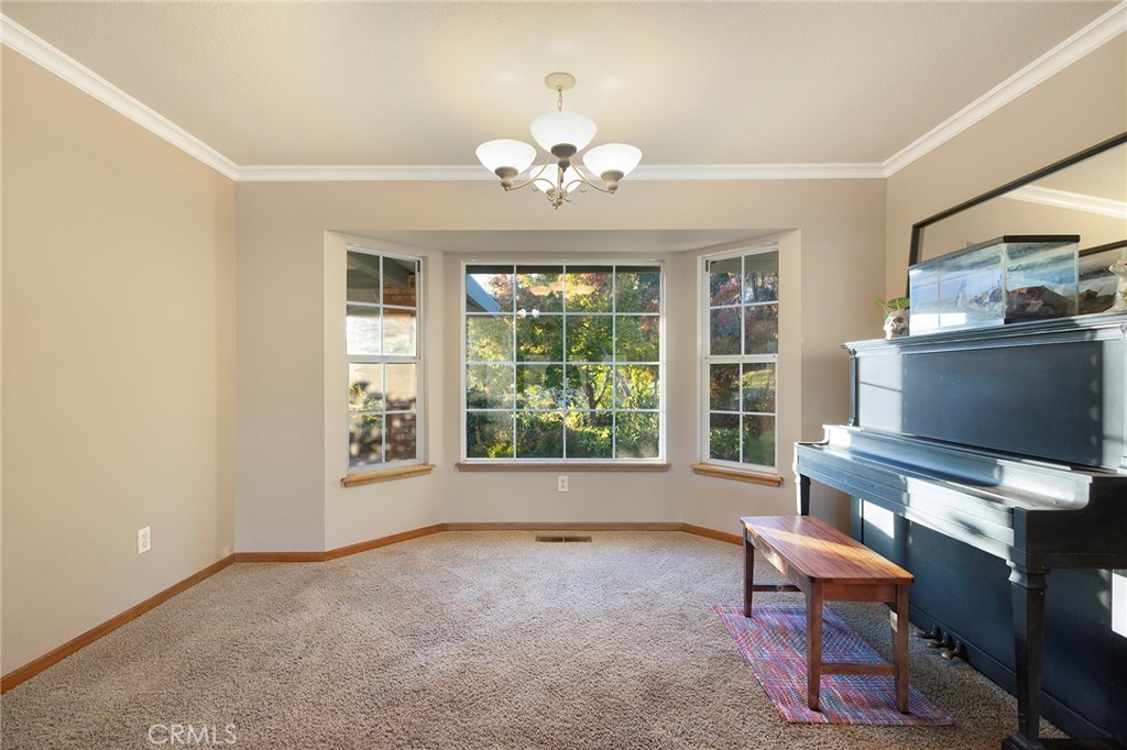 14856 Eagle Ridge Drive Forest Ranch, CA 95942 - Photo 19 of 27 a living room with furniture and a window