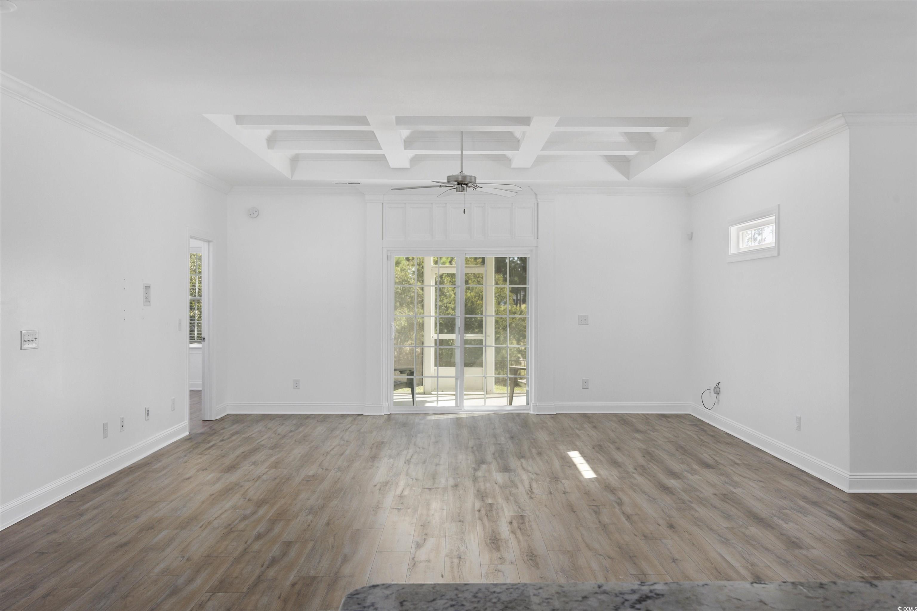 1108 Pochard Drive Conway, SC 29526 - Photo 11 of 37 Unfurnished living room with coffered ceiling, crown molding, wood finished floors, beamed ceiling, and a ceiling fan