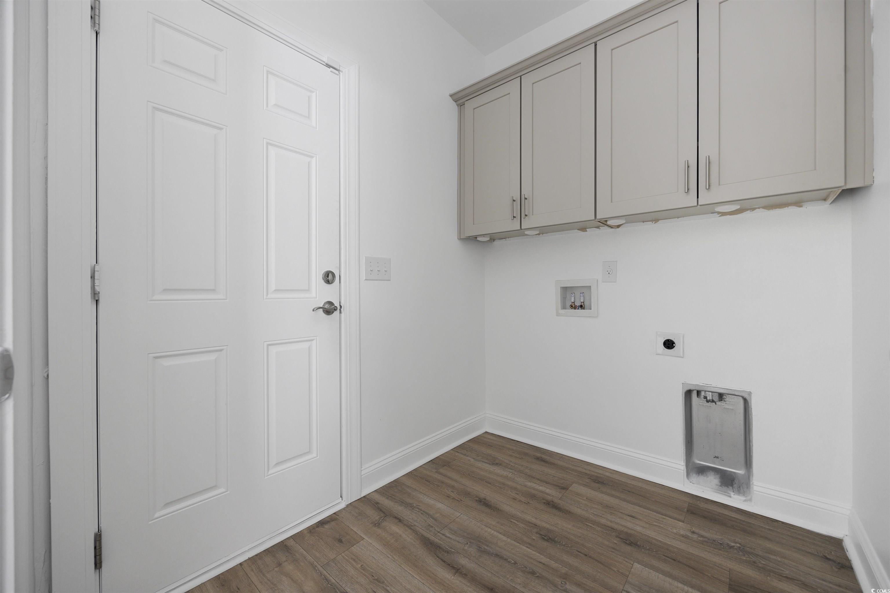 1108 Pochard Drive Conway, SC 29526 - Photo 16 of 37 Laundry area with dark wood-style floors, hookup for a washing machine, hookup for an electric dryer, and cabinet space
