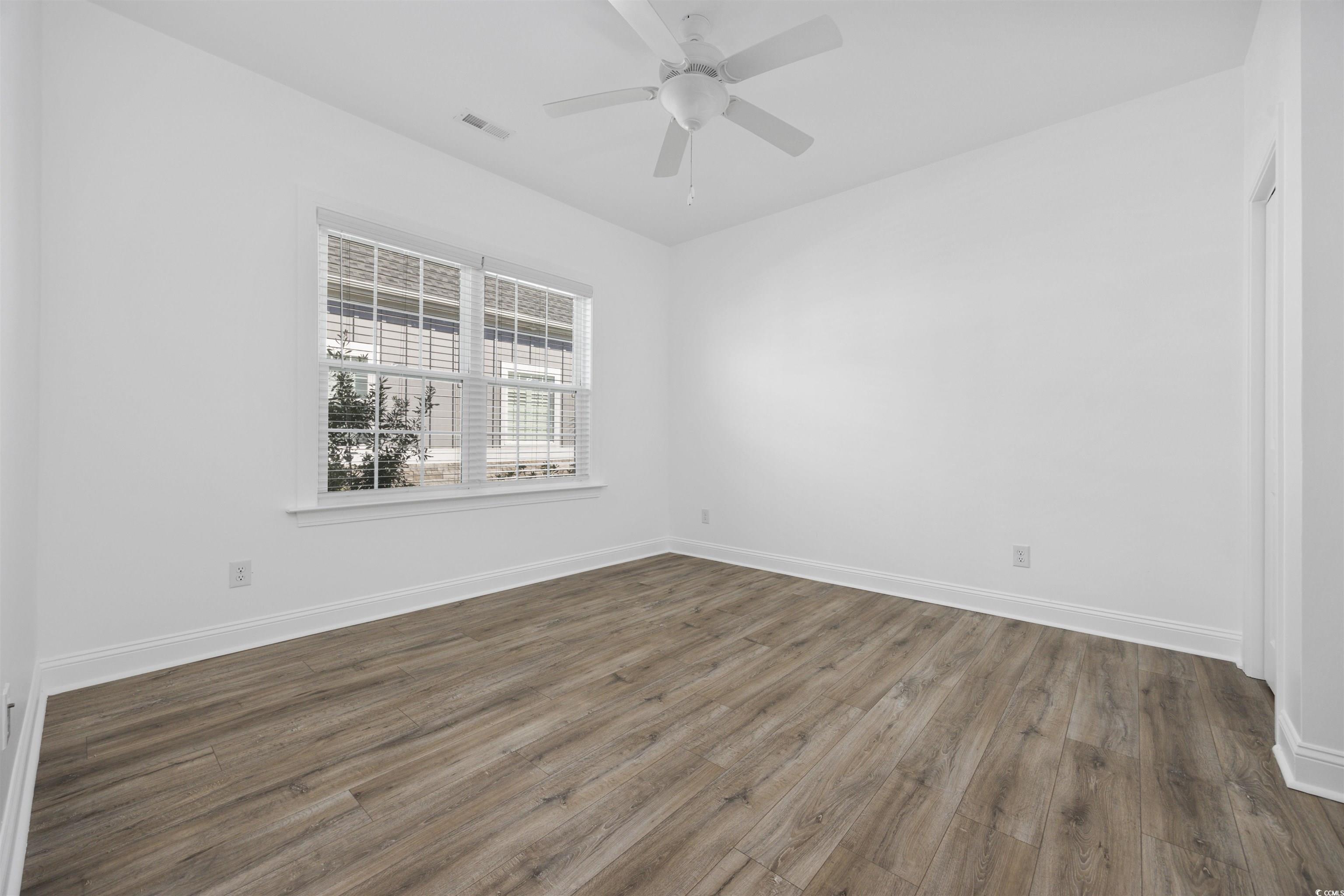 1108 Pochard Drive Conway, SC 29526 - Photo 24 of 37 Spare room with dark wood-style floors and ceiling fan