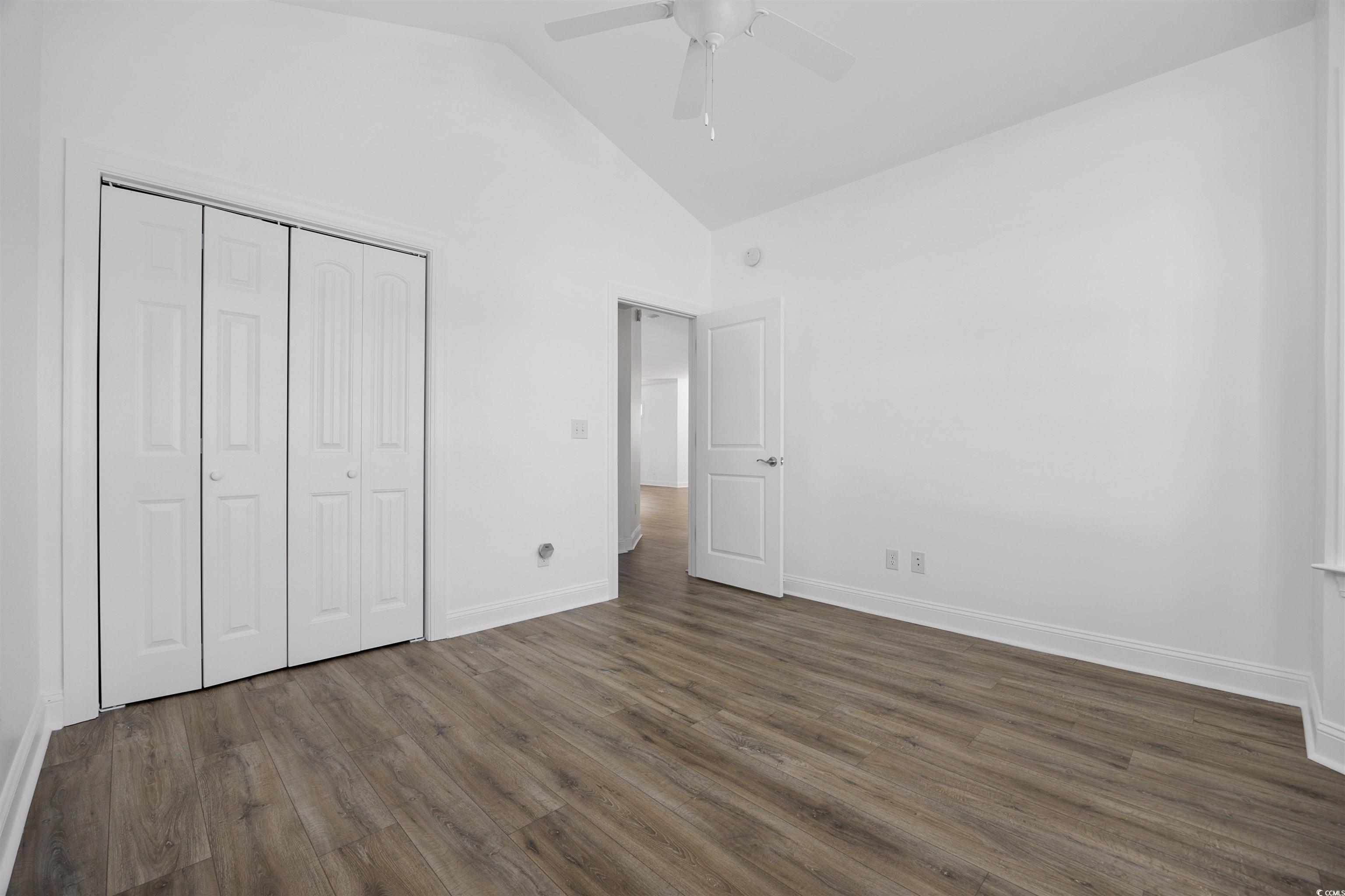 1108 Pochard Drive Conway, SC 29526 - Photo 27 of 37 Unfurnished bedroom with dark wood-style floors, a closet, ceiling fan, and high vaulted ceiling