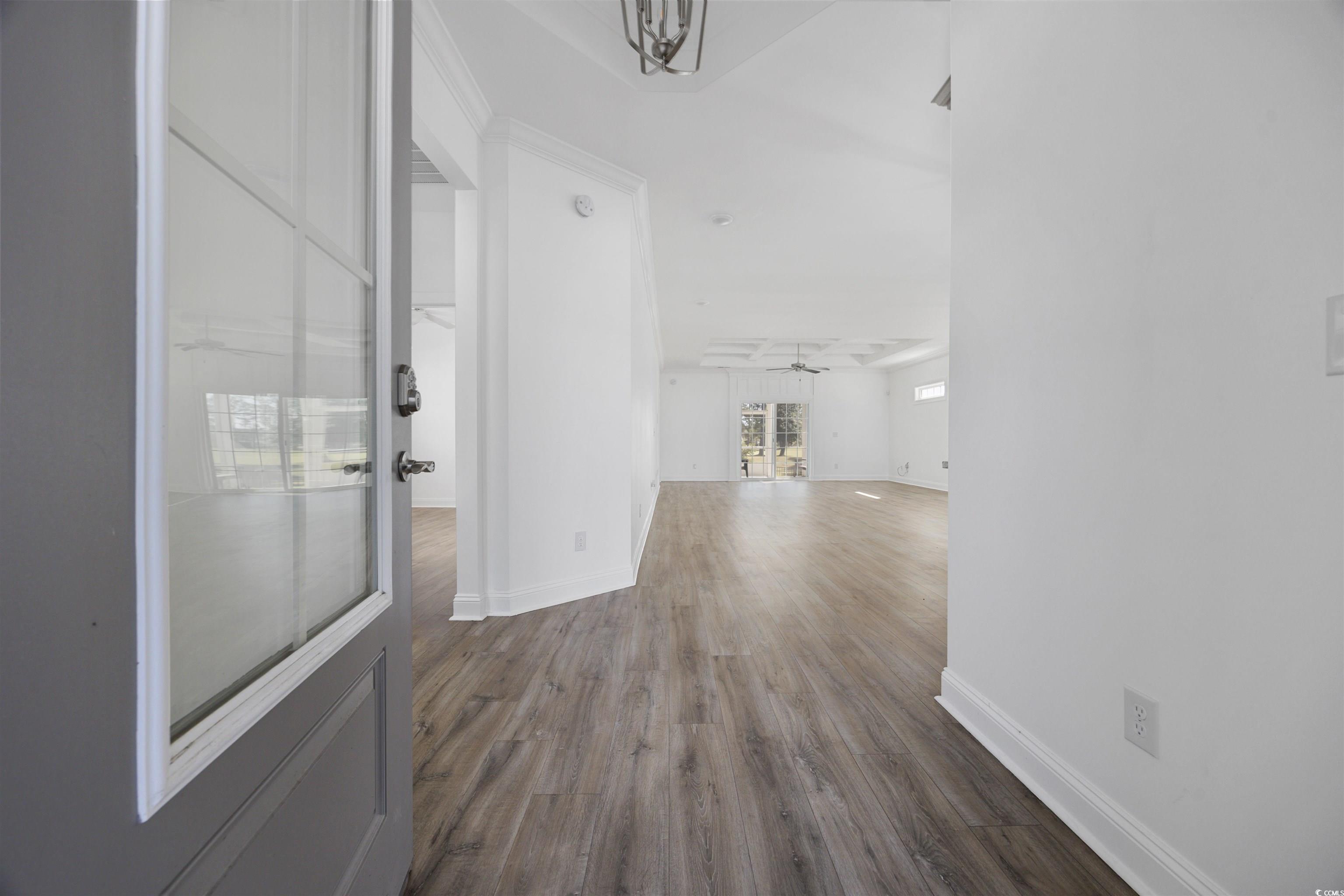 1108 Pochard Drive Conway, SC 29526 - Photo 4 of 37 Hall featuring dark wood-style flooring and a chandelier