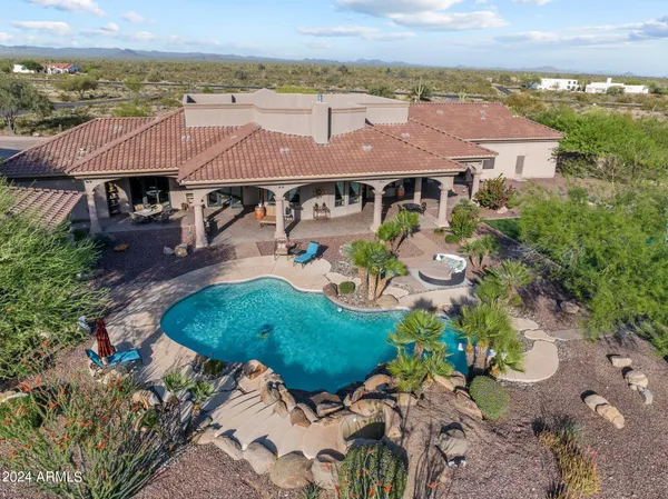 an aerial view of a house with a garden