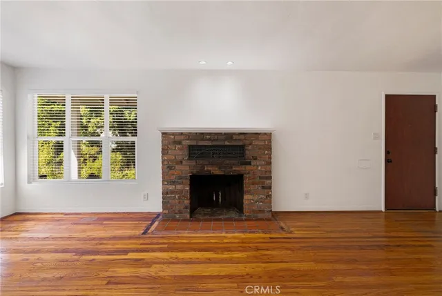 a kitchen with granite countertop a refrigerator and a stove