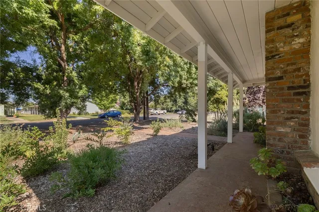 an empty room with wooden floor and closet