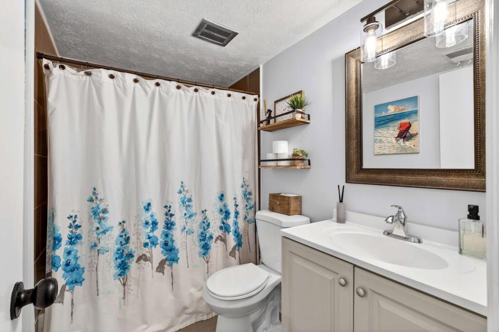 725 Dalrymple Road, Unit 5F Sandy Springs, GA 30328 - Photo 19 of 33 a bathroom with a sink toilet and shower