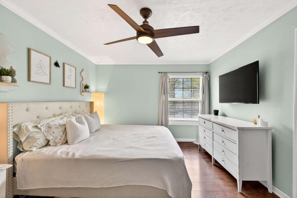 725 Dalrymple Road, Unit 5F Sandy Springs, GA 30328 - Photo 22 of 33 a bedroom with a bed and a flat screen tv