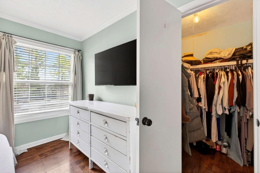 725 Dalrymple Road, Unit 5F Sandy Springs, GA 30328 - Photo 23 of 33 a view of walk in closet with clothes and shoes