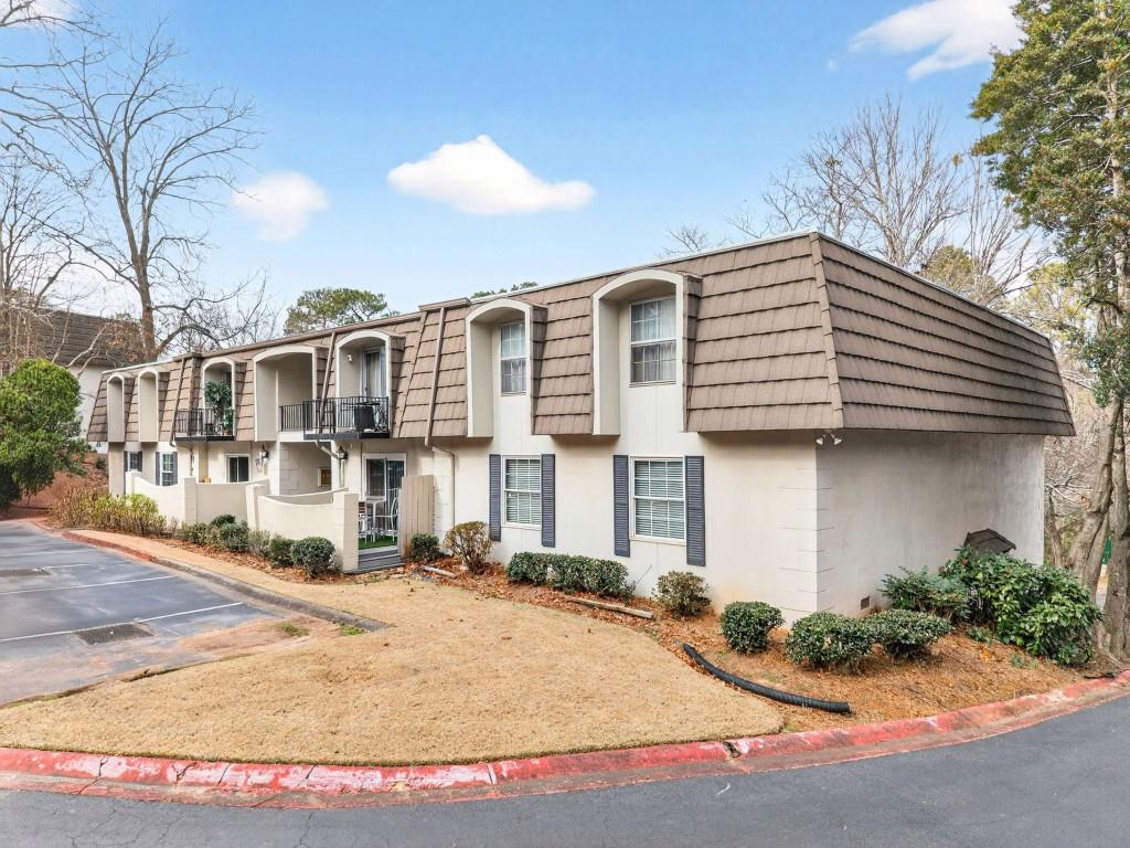 725 Dalrymple Road, Unit 5F Sandy Springs, GA 30328 - Photo 27 of 33 a view of a white building among the street