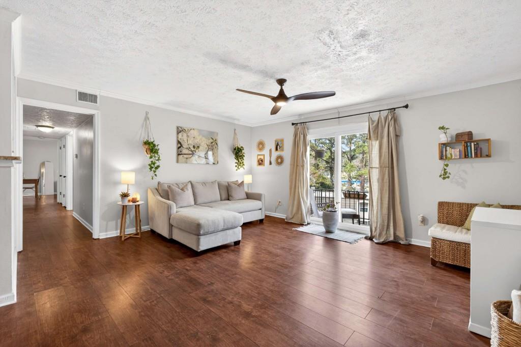 725 Dalrymple Road, Unit 5F Sandy Springs, GA 30328 - Photo 4 of 33 a living room with furniture and a large window