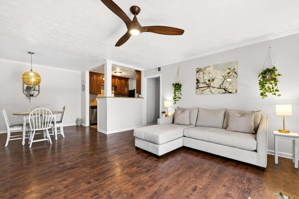 725 Dalrymple Road, Unit 5F Sandy Springs, GA 30328 - Photo 7 of 33 a living room with furniture wooden floor and dining table