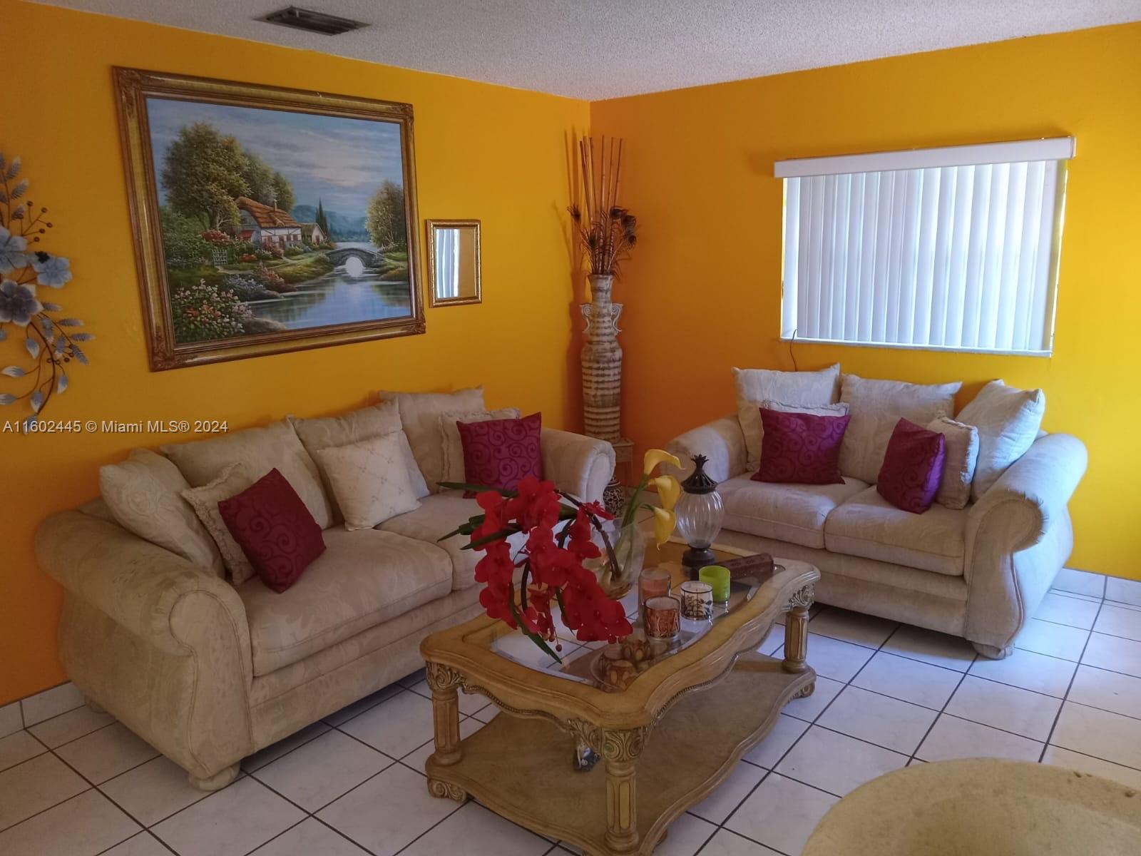 Westview Miami, FL 33167 - Photo 3 of 10 a living room with furniture and a couch