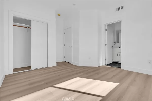a bathroom with a toilet sink and shower