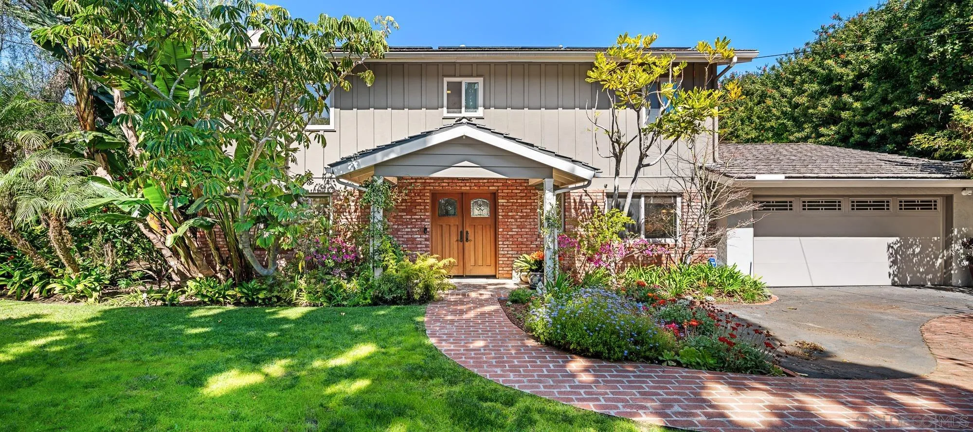1669 Los Altos Road San Diego, CA 92109 - Photo 1 of 62 a front view of a house with garden
