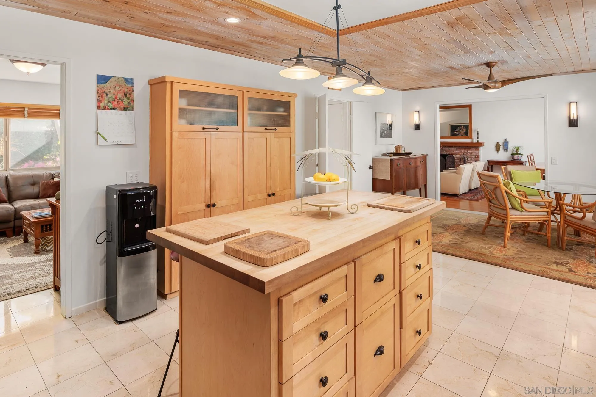 1669 Los Altos Road San Diego, CA 92109 - Photo 16 of 62 a kitchen that has a lot of cabinets a sink and a wooden floor