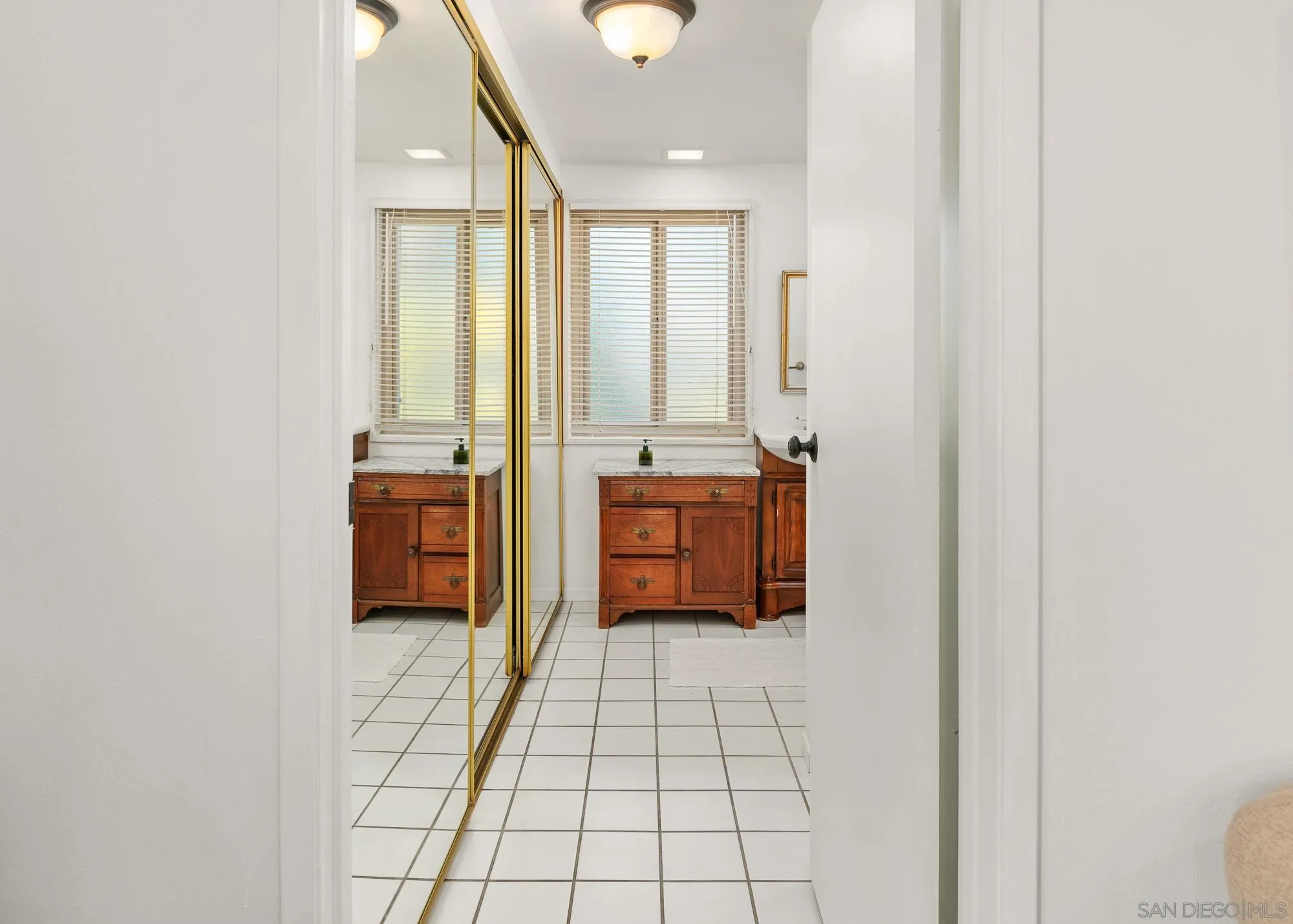 1669 Los Altos Road San Diego, CA 92109 - Photo 22 of 62 a spacious bathroom with a mirror a bathtub and a shower