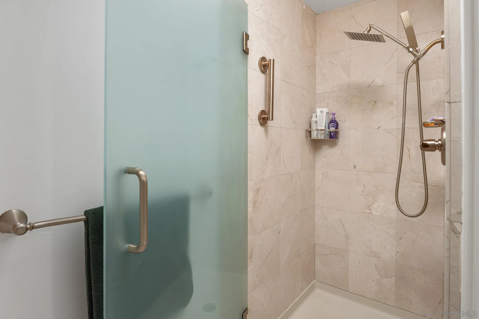 1669 Los Altos Road San Diego, CA 92109 - Photo 24 of 62 a bathroom with a glass shower door