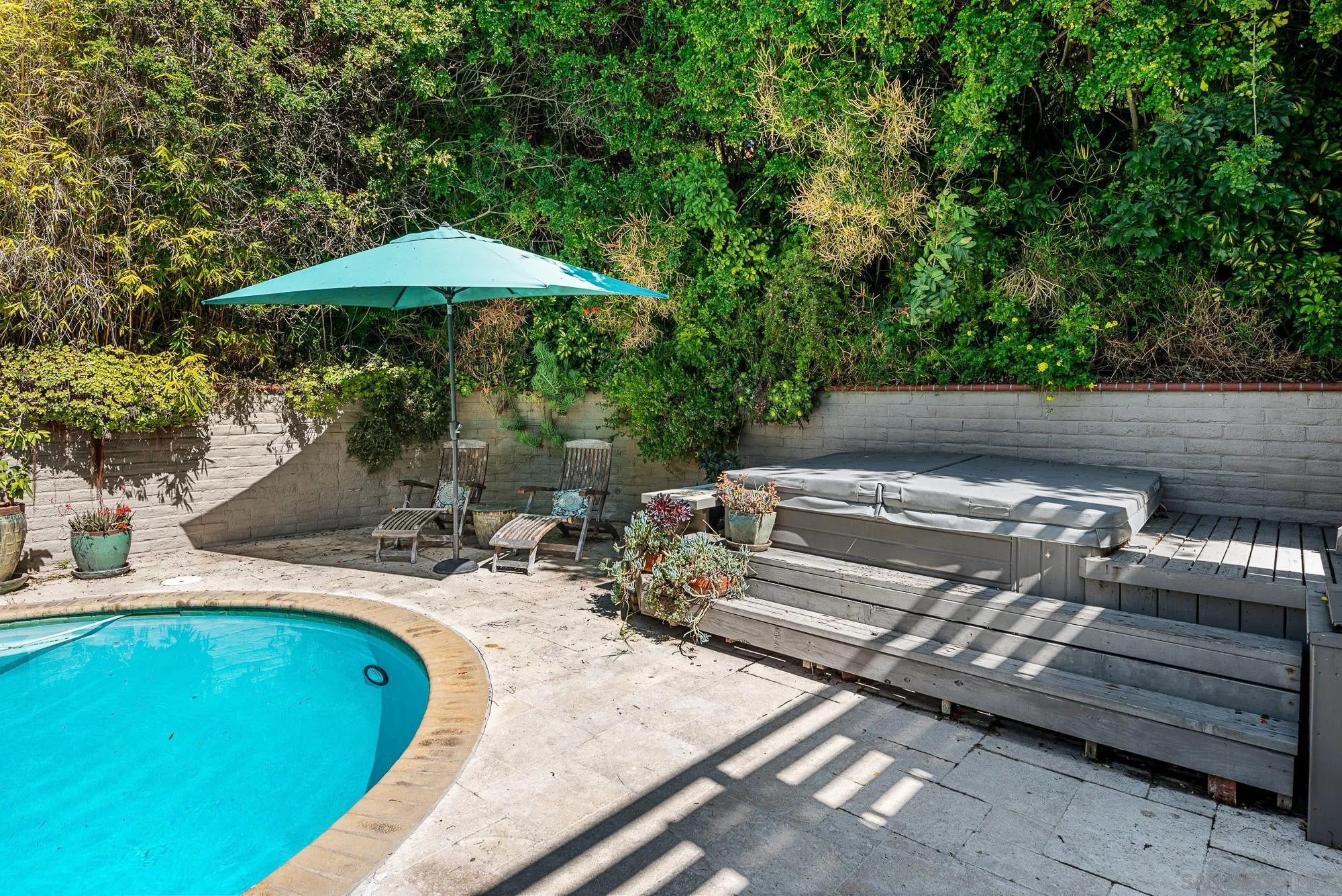 1669 Los Altos Road San Diego, CA 92109 - Photo 38 of 62 a view of a backyard with sitting area