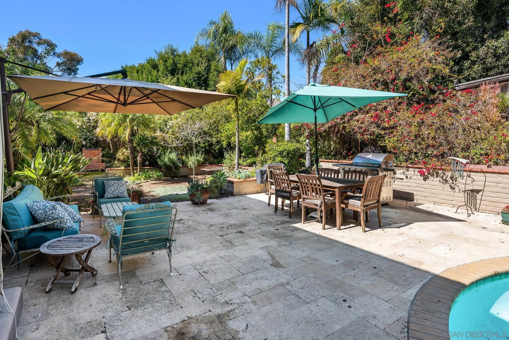 1669 Los Altos Road San Diego, CA 92109 - Photo 39 of 62 a view of a tables and chairs under an umbrella in patio
