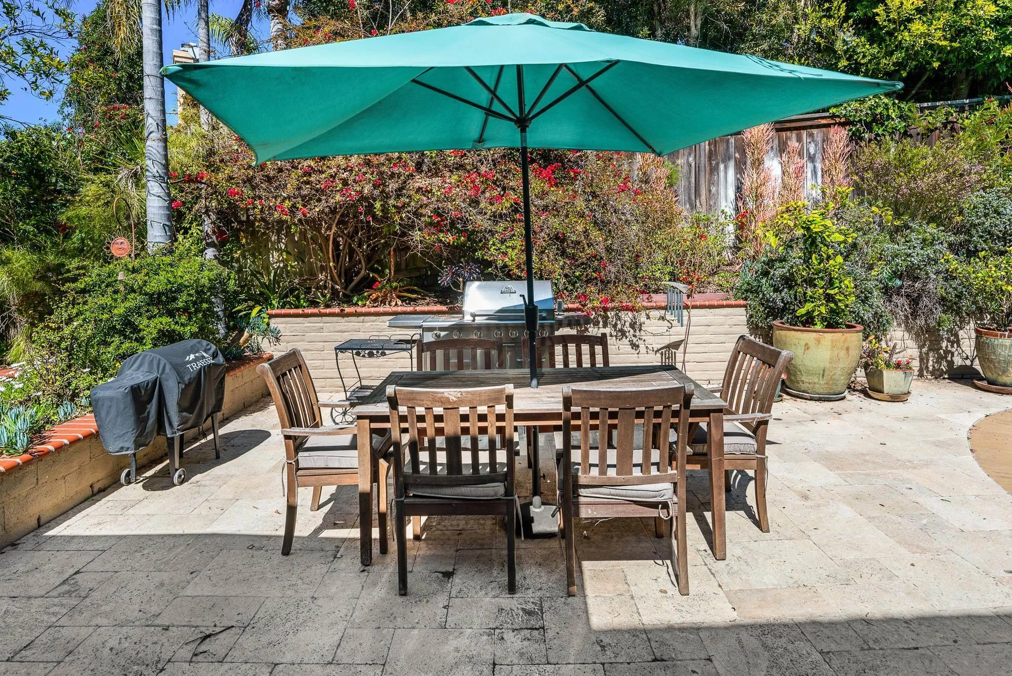 1669 Los Altos Road San Diego, CA 92109 - Photo 40 of 62 a patio with a patio table and chairs