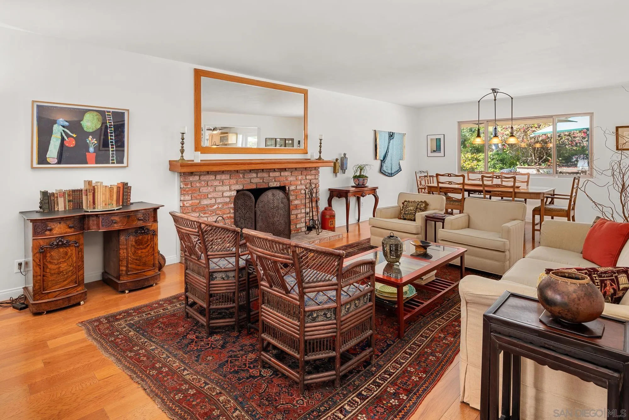 1669 Los Altos Road San Diego, CA 92109 - Photo 4 of 62 a living room with furniture a fireplace and a table