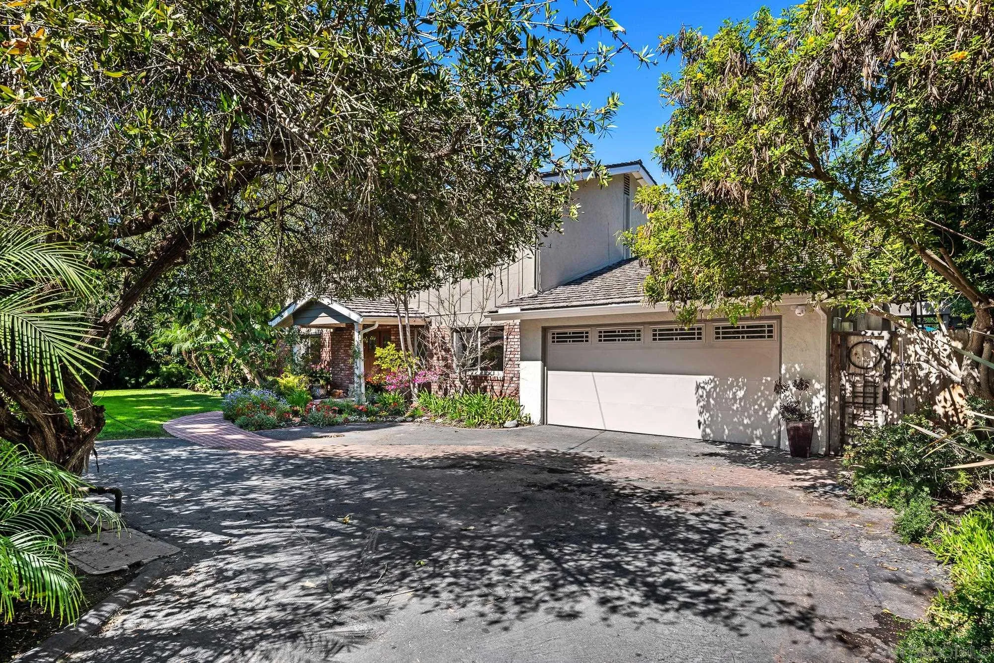 1669 Los Altos Road San Diego, CA 92109 - Photo 56 of 62 a front view of a house with a garden