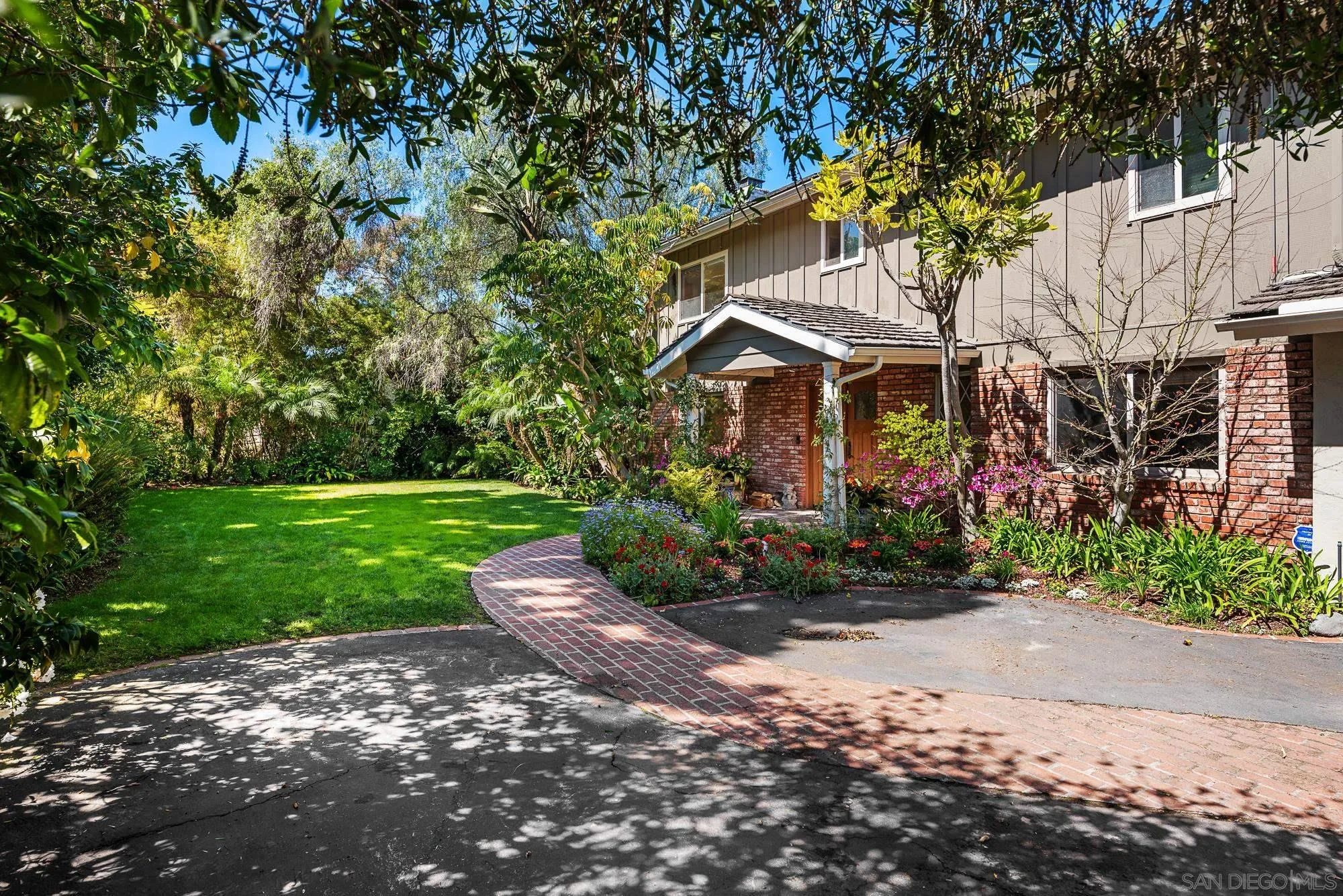 1669 Los Altos Road San Diego, CA 92109 - Photo 58 of 62 a front view of a house with a yard