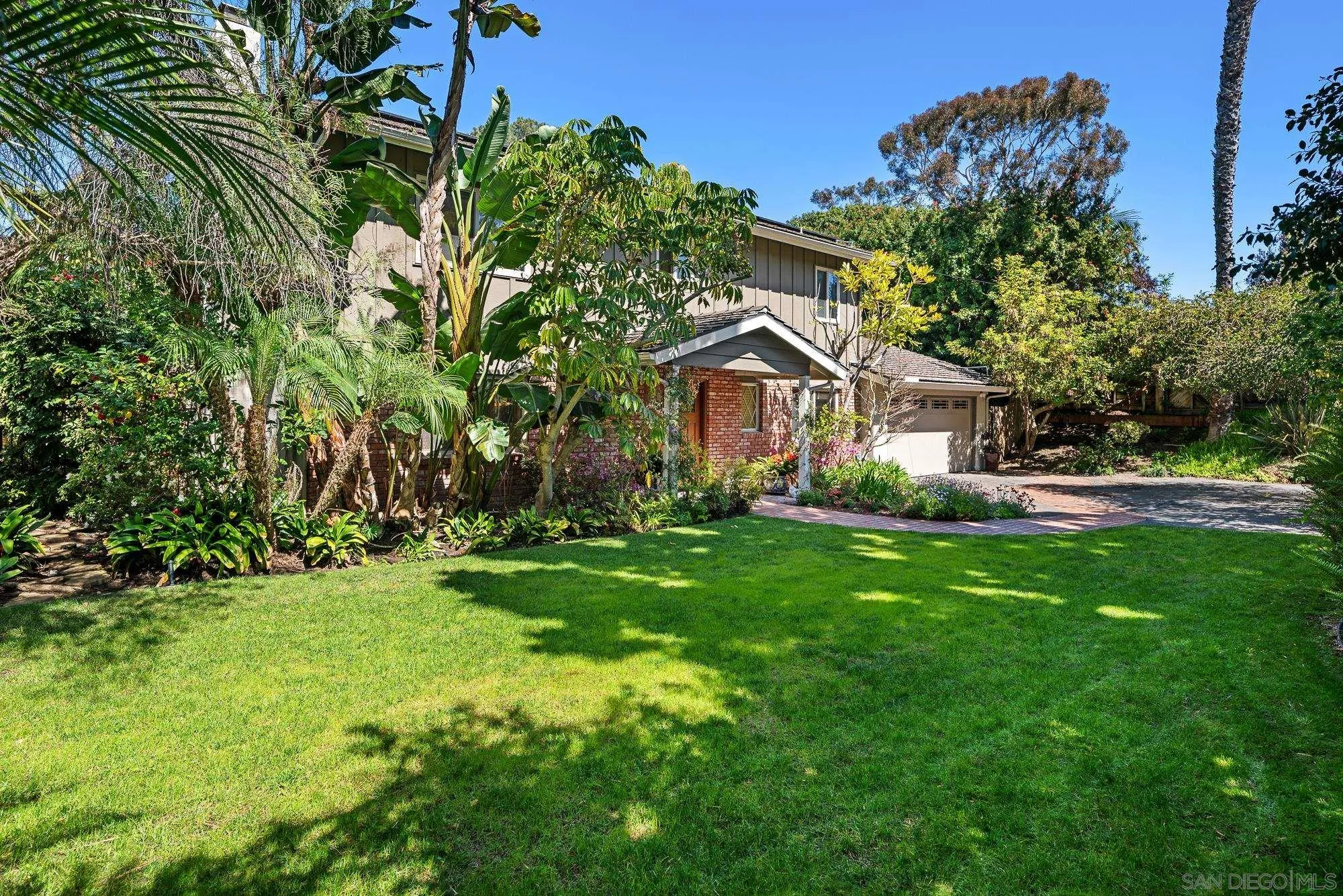 1669 Los Altos Road San Diego, CA 92109 - Photo 59 of 62 a front view of a house with a yard