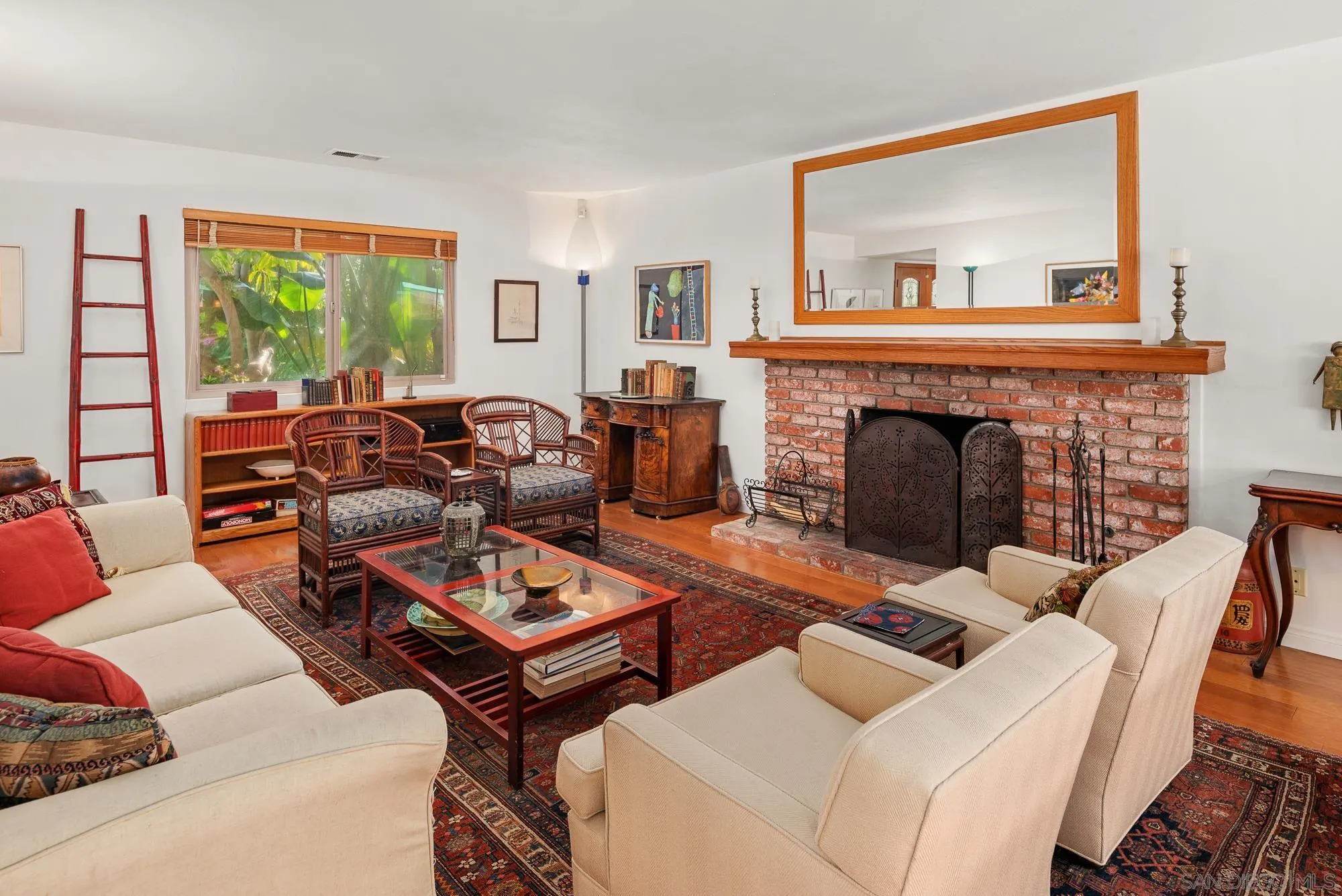 1669 Los Altos Road San Diego, CA 92109 - Photo 6 of 62 a living room with furniture a large window and a fireplace