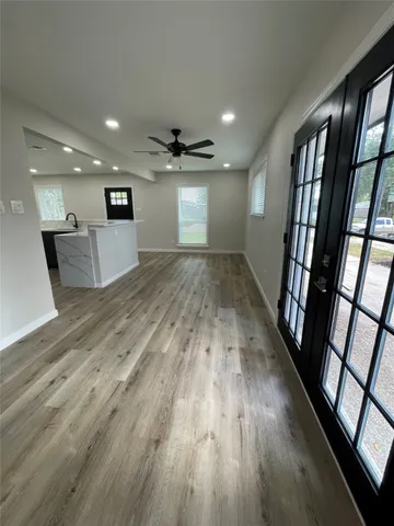 wooden floor with a window in a room
