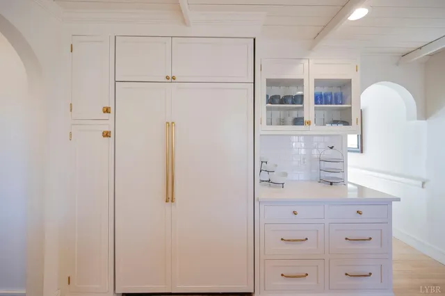 a kitchen with a stove and cabinets