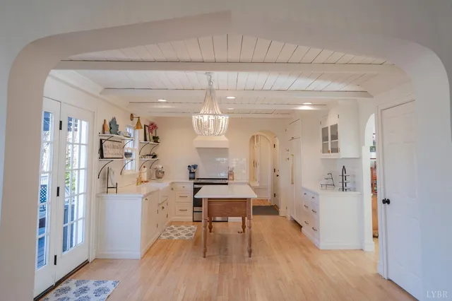 a living room with furniture fireplace and window