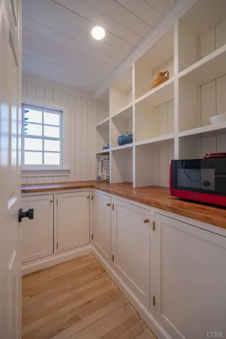 a bathroom with a granite countertop sink mirror and a bathtub